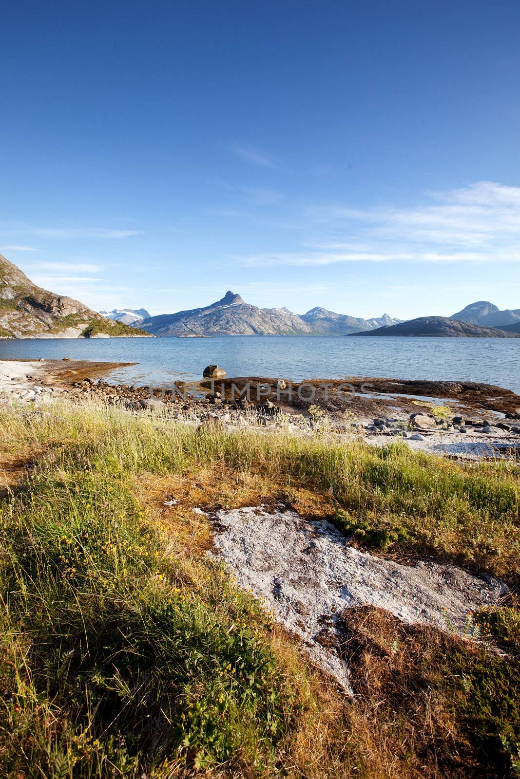 The coast in northern Norway with mountains, ocean and rock