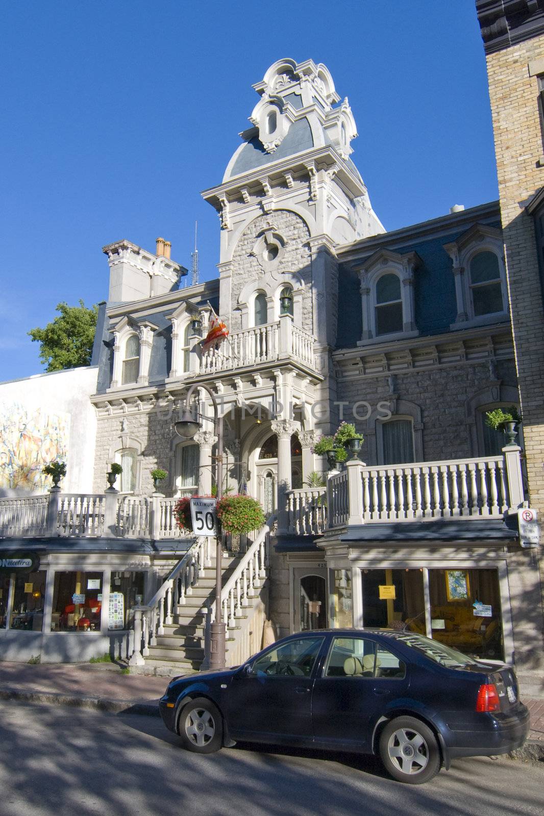 A white house in a typical Quebec street