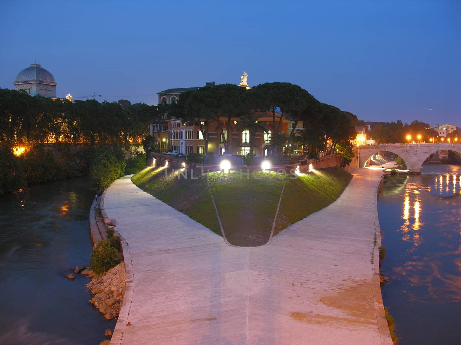 A view from a bridge of Rome in a summer night