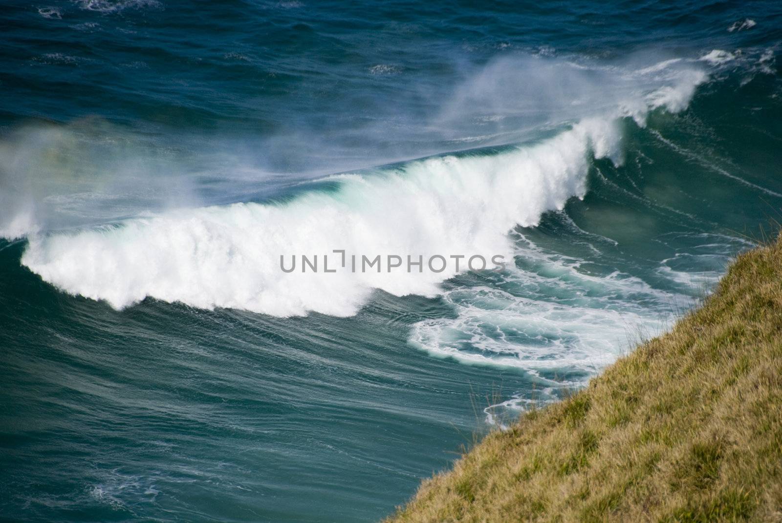 Waves about to crush on the Cliffs
