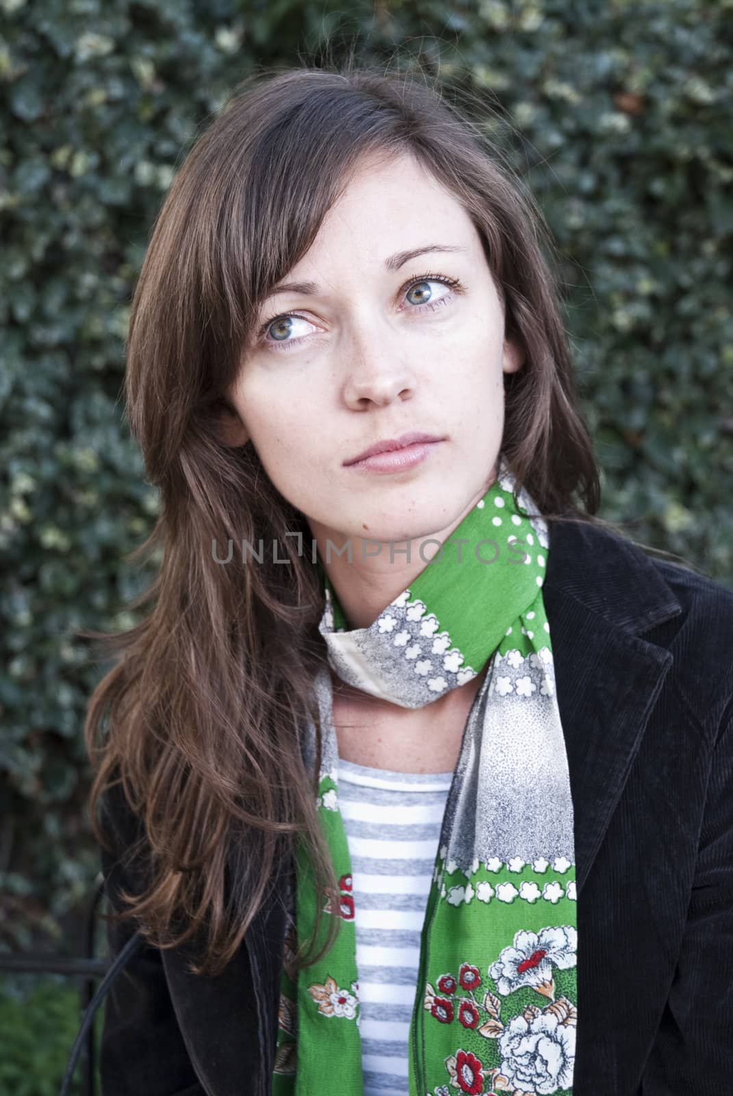 Portrait of young woman looking thoughtful.