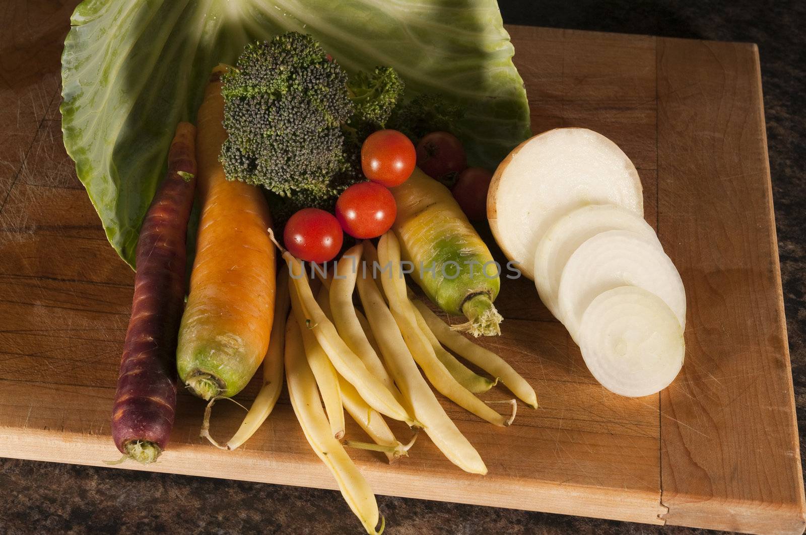 Arrangement of many different vegetables on a cutting board