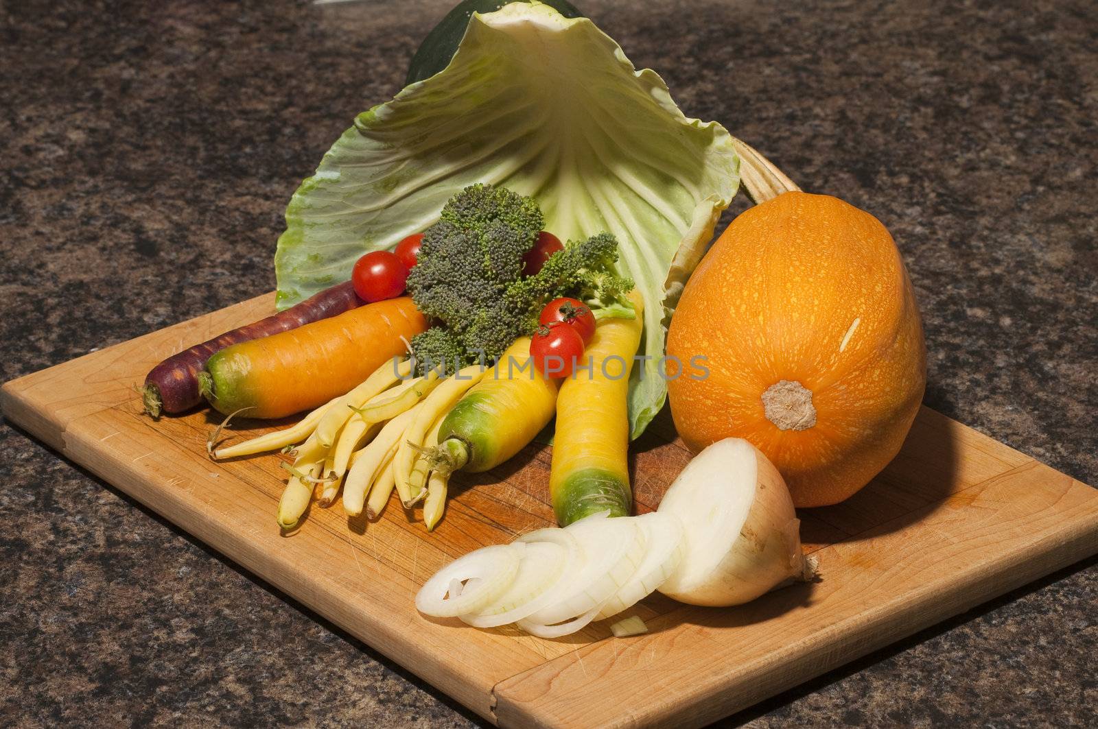 Arrangement of many different vegetables on a cutting board