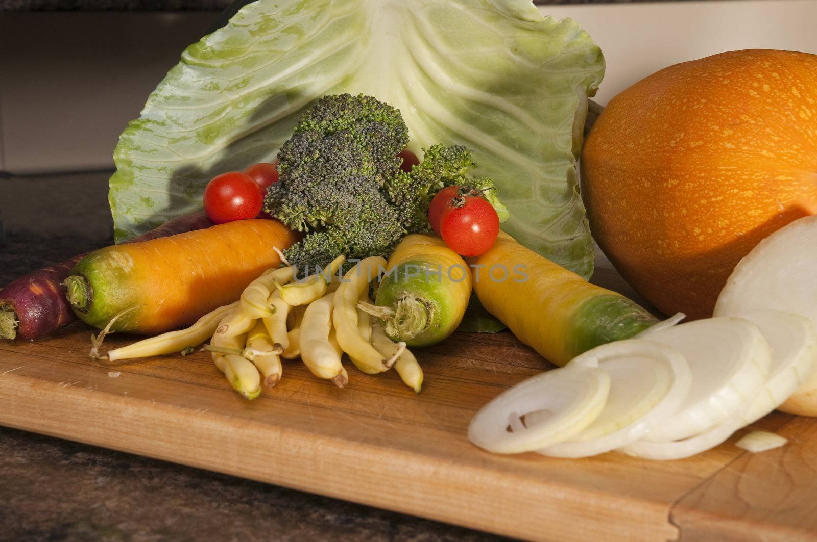 Arrangement of many different vegetables on a cutting board