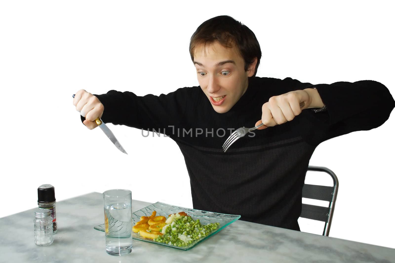 Hungry young man ready to eat, isolated over white backgroud