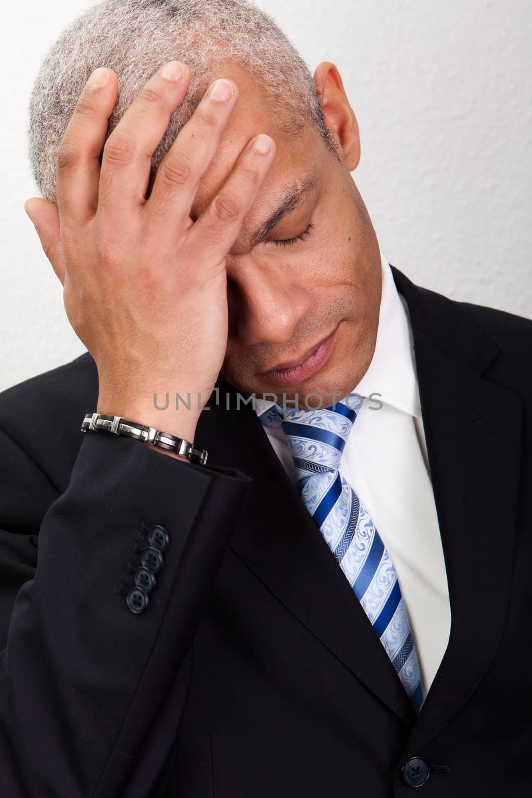 Stressed Businessman Man With Headache and holding his head