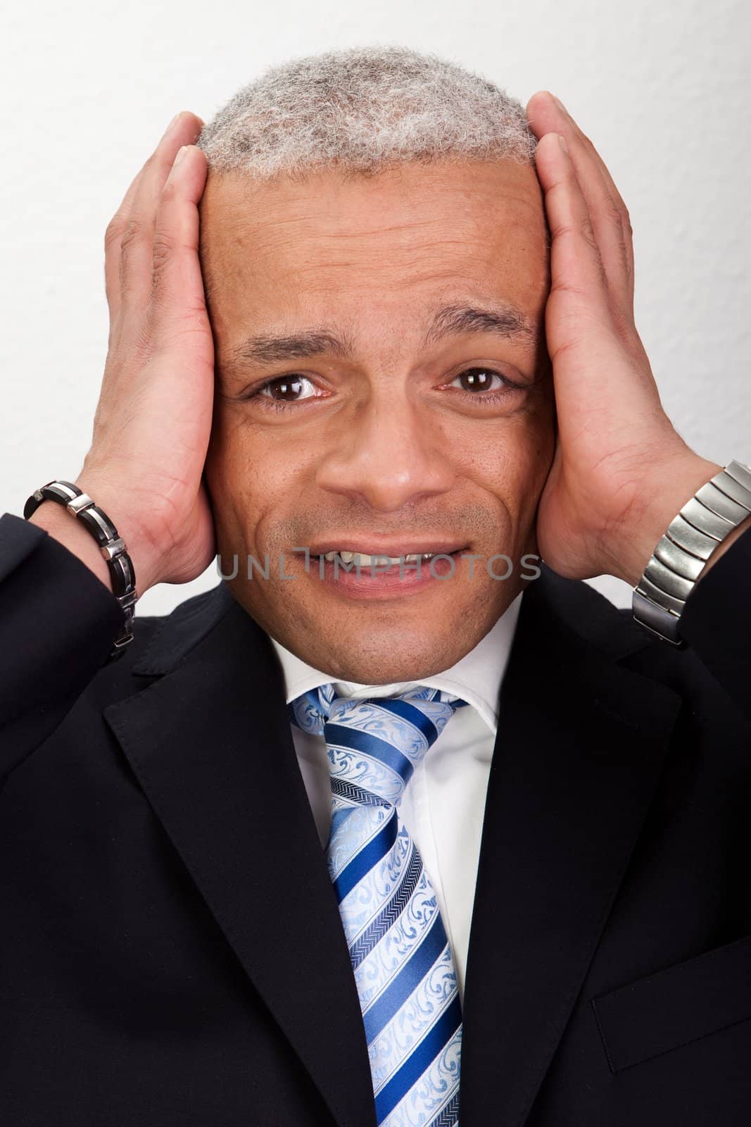 Stressed Businessman Man With Headache and holding his head