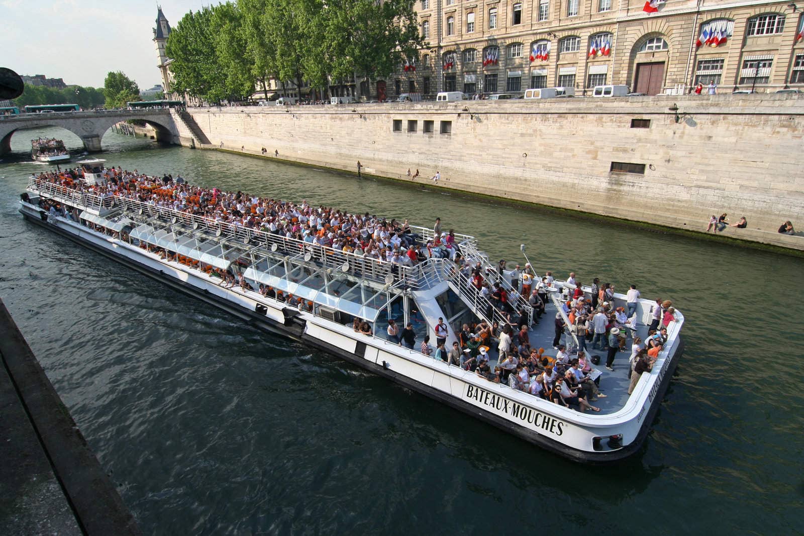 Giant canal boat with tourists in the Seine in Paris, France