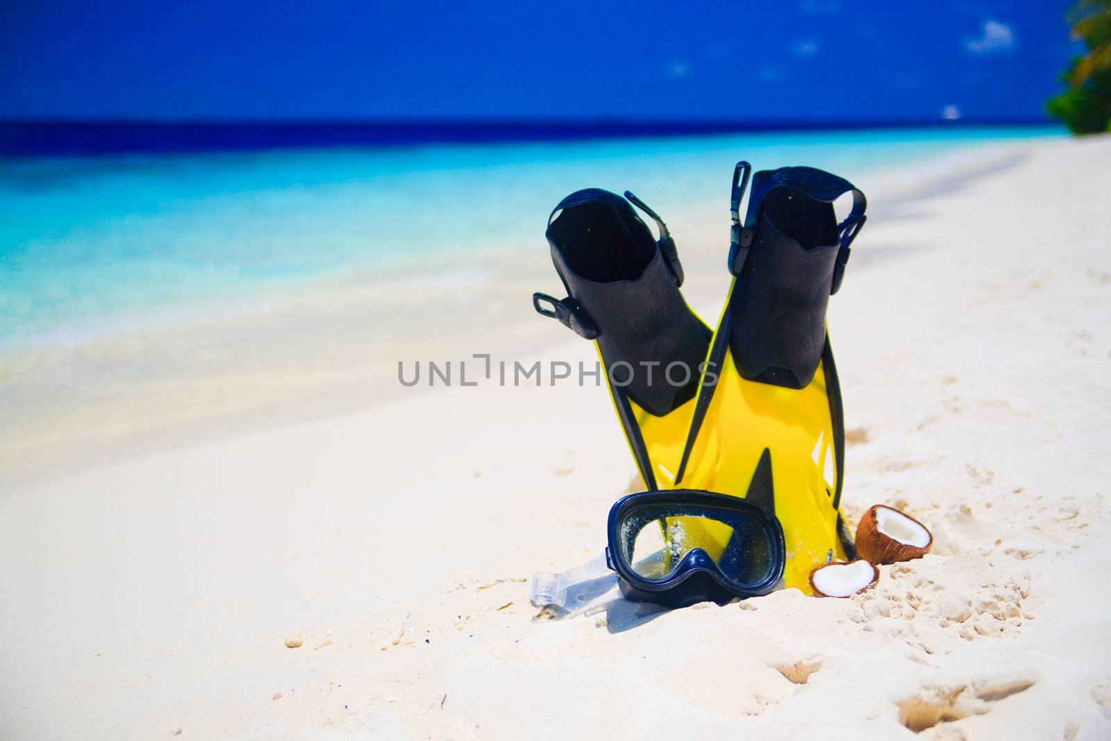 snorekl equipment on white sand beach at Maldives