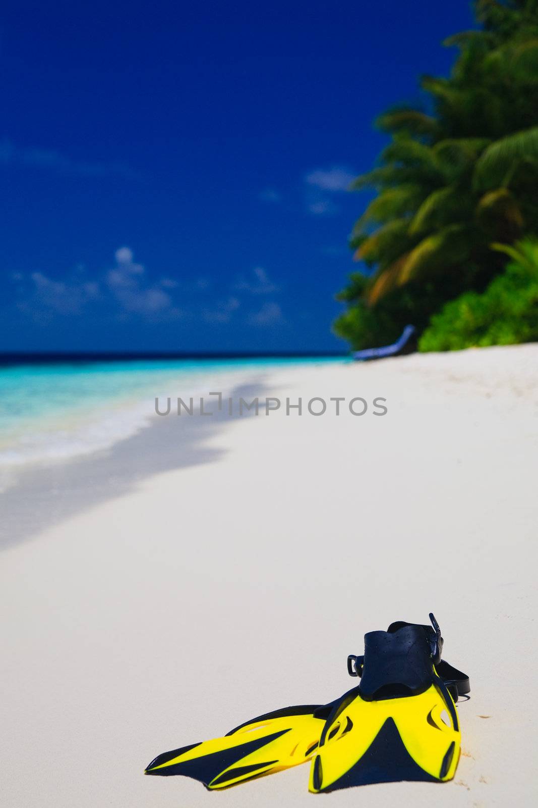 snorekl equipment on white sand beach at Maldives