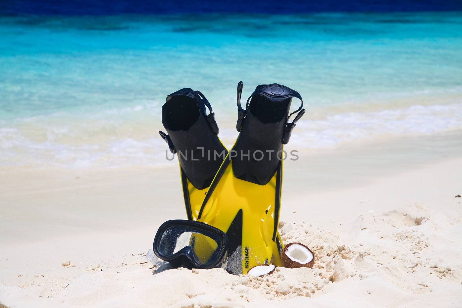 snorekl equipment on white sand beach at Maldives