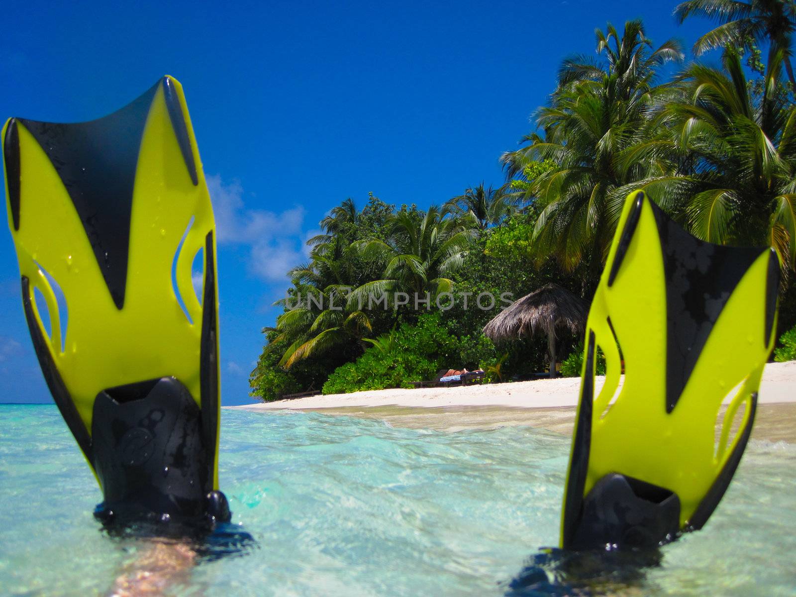 snorekl equipment on white sand beach at Maldives