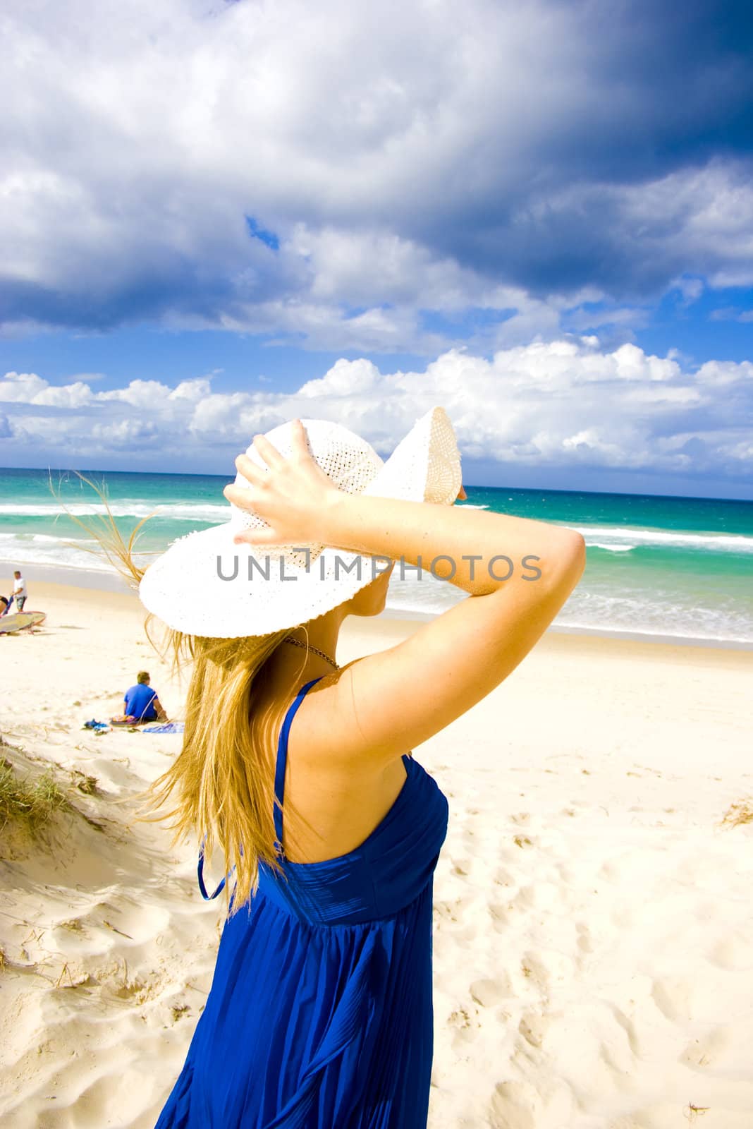 pretty young girl at the beach in summer