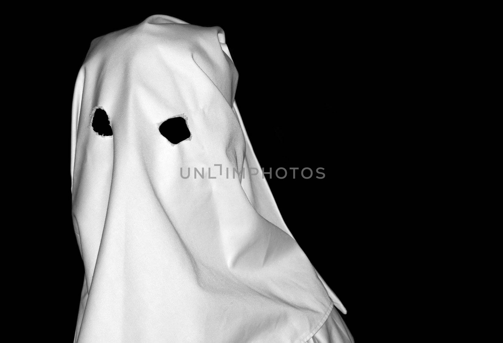Spooky white figure over clear black backdrop