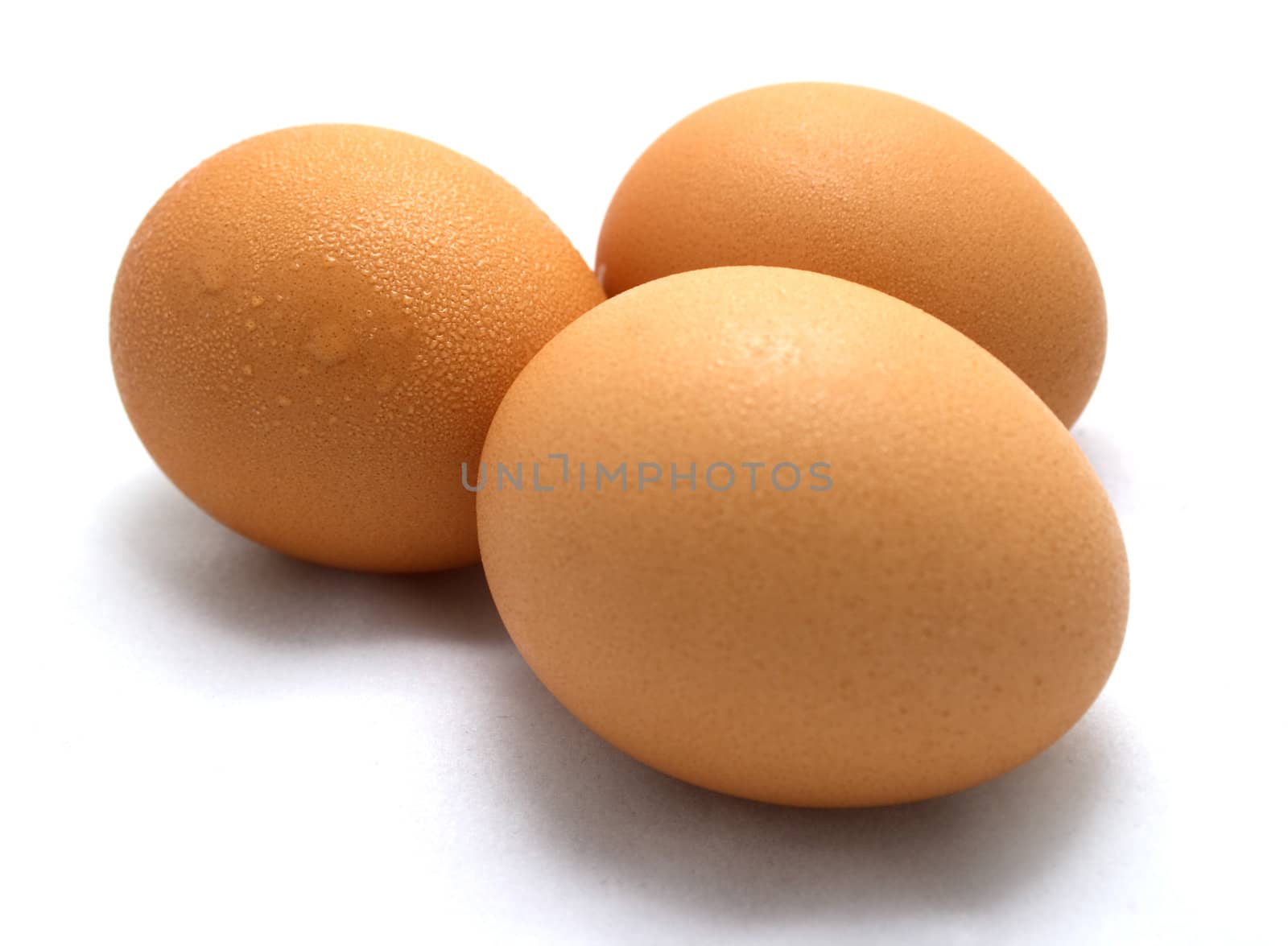 Three eggs on white background