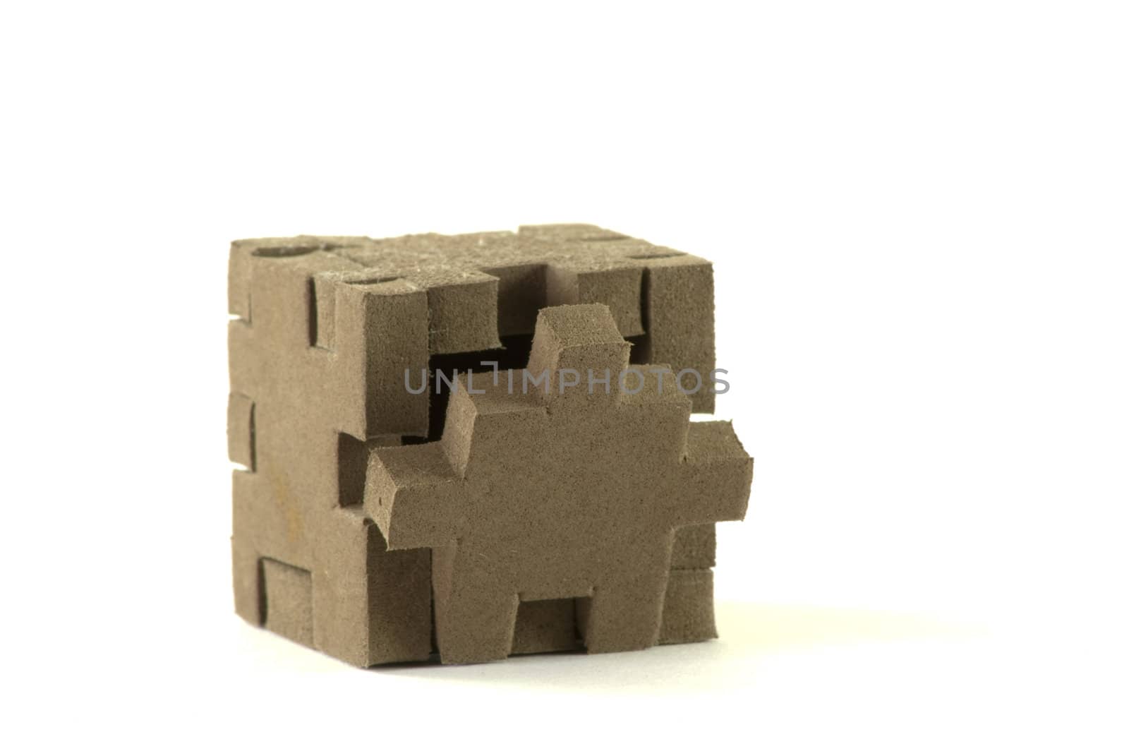 Foam material box with puzzle shaped sides.