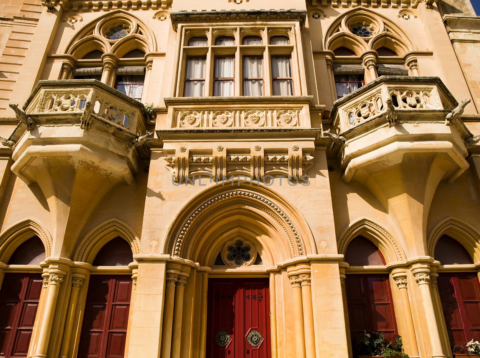 A medieval limestone facade in traditional Gothic style in Mdina on the island of Malta