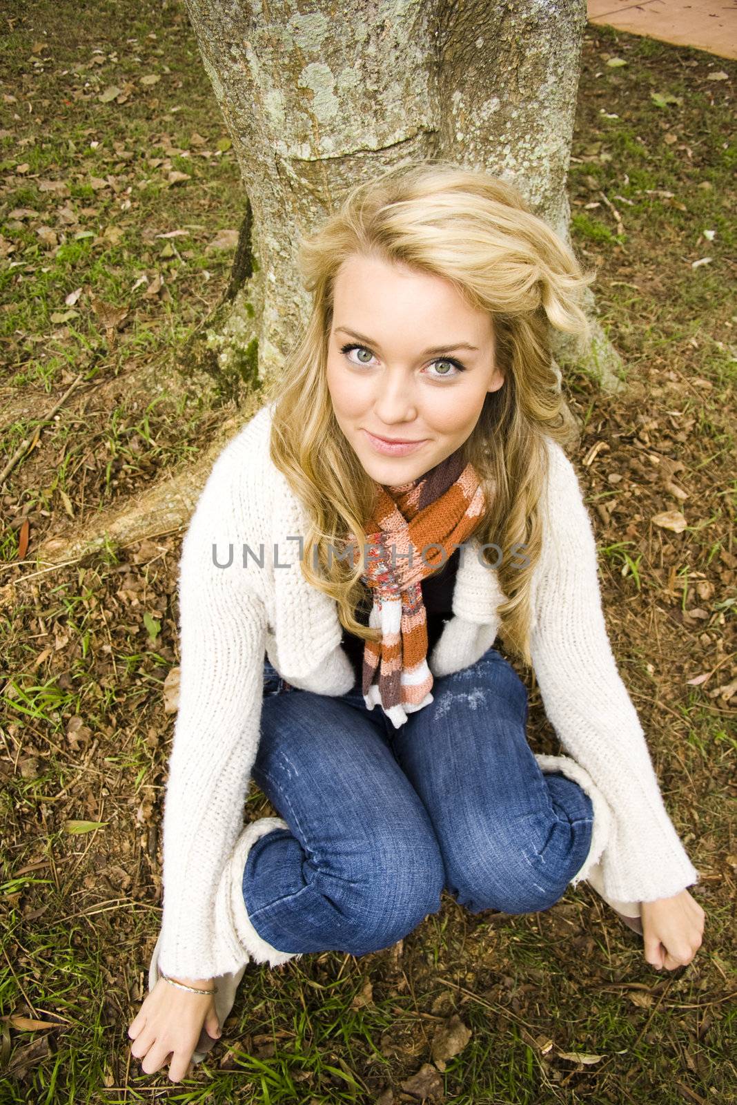 pretty girl under a tree smiling