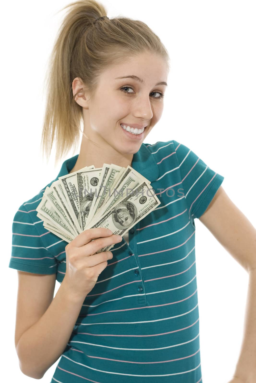 Happy young woman shows off a handful of cash.