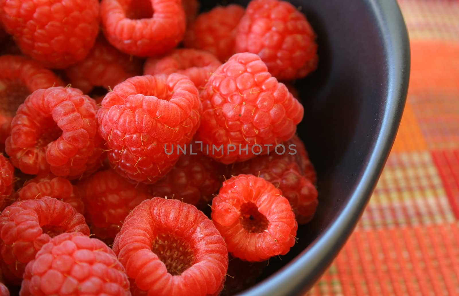 Sweet raspberries in a bowl

