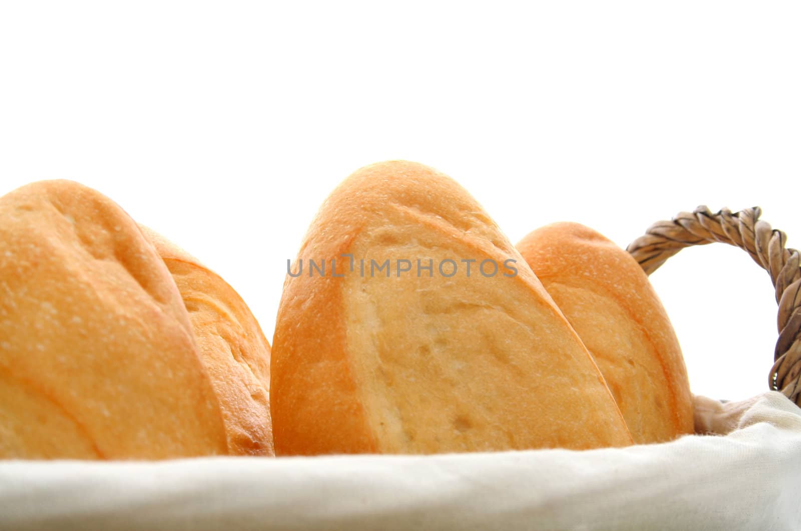 basket of bread isolated on white background.