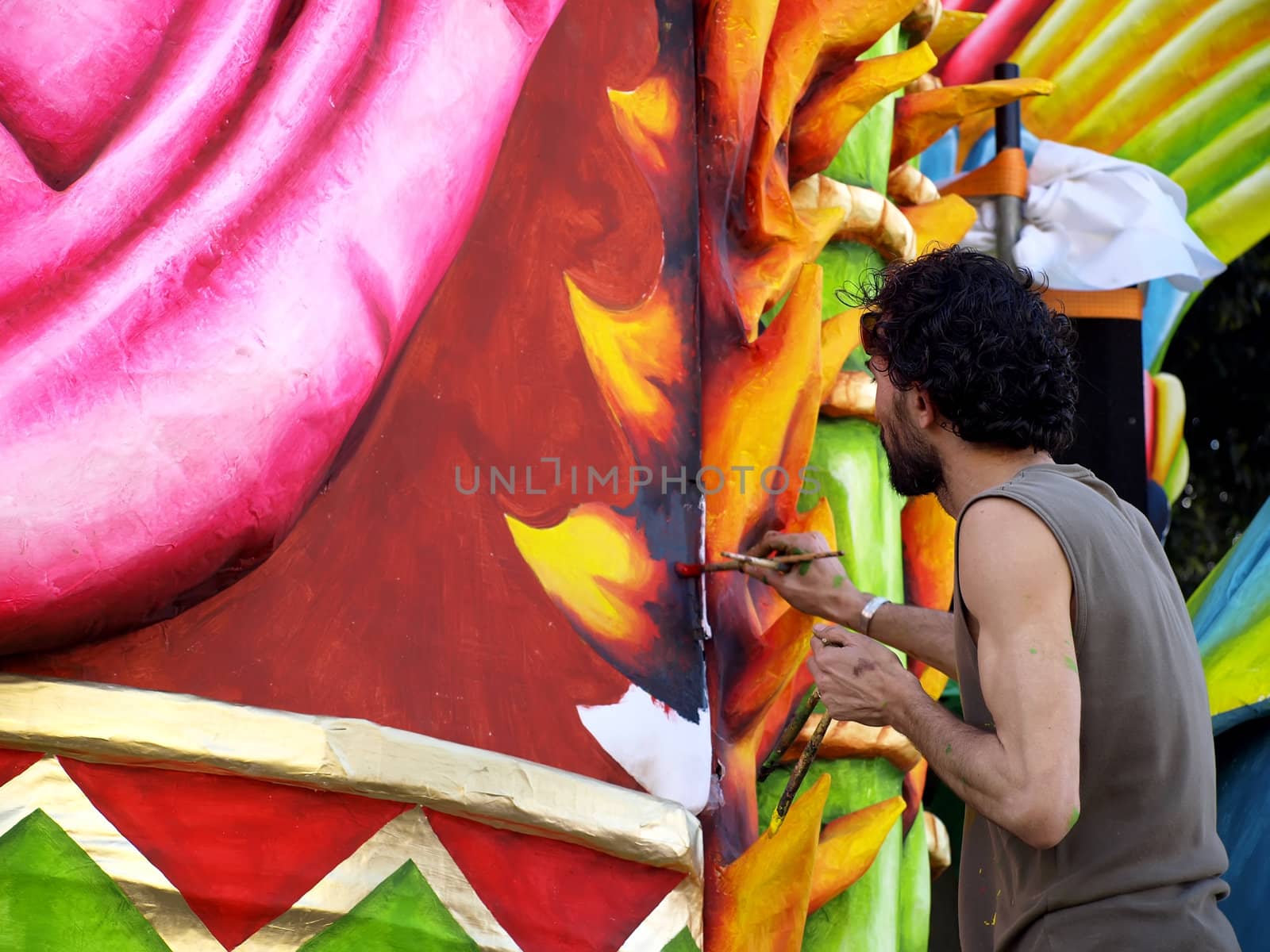 Artist applying final touches to float from the International Carnival of Malta 2008  