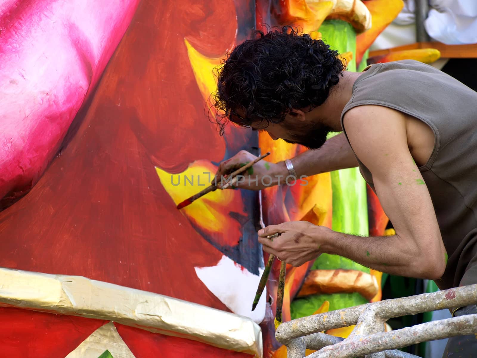 Artist applying final touches to float from the International Carnival of Malta 2008  