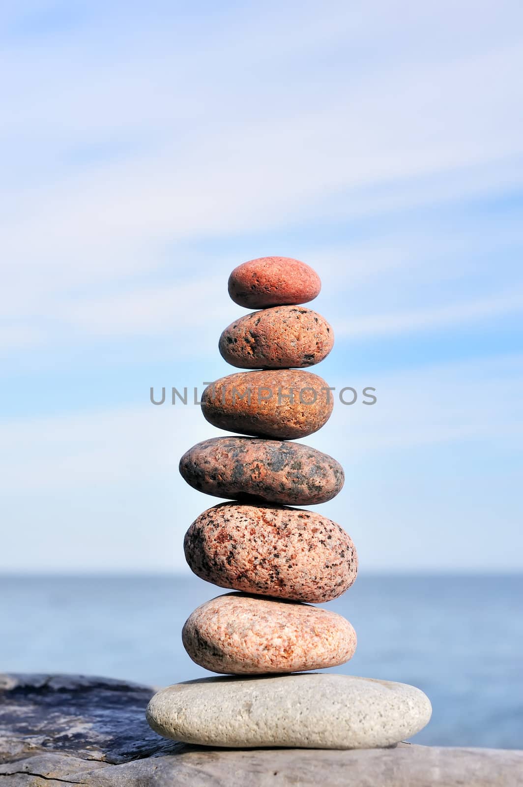 Different amounts of colored pebble as the pyramid