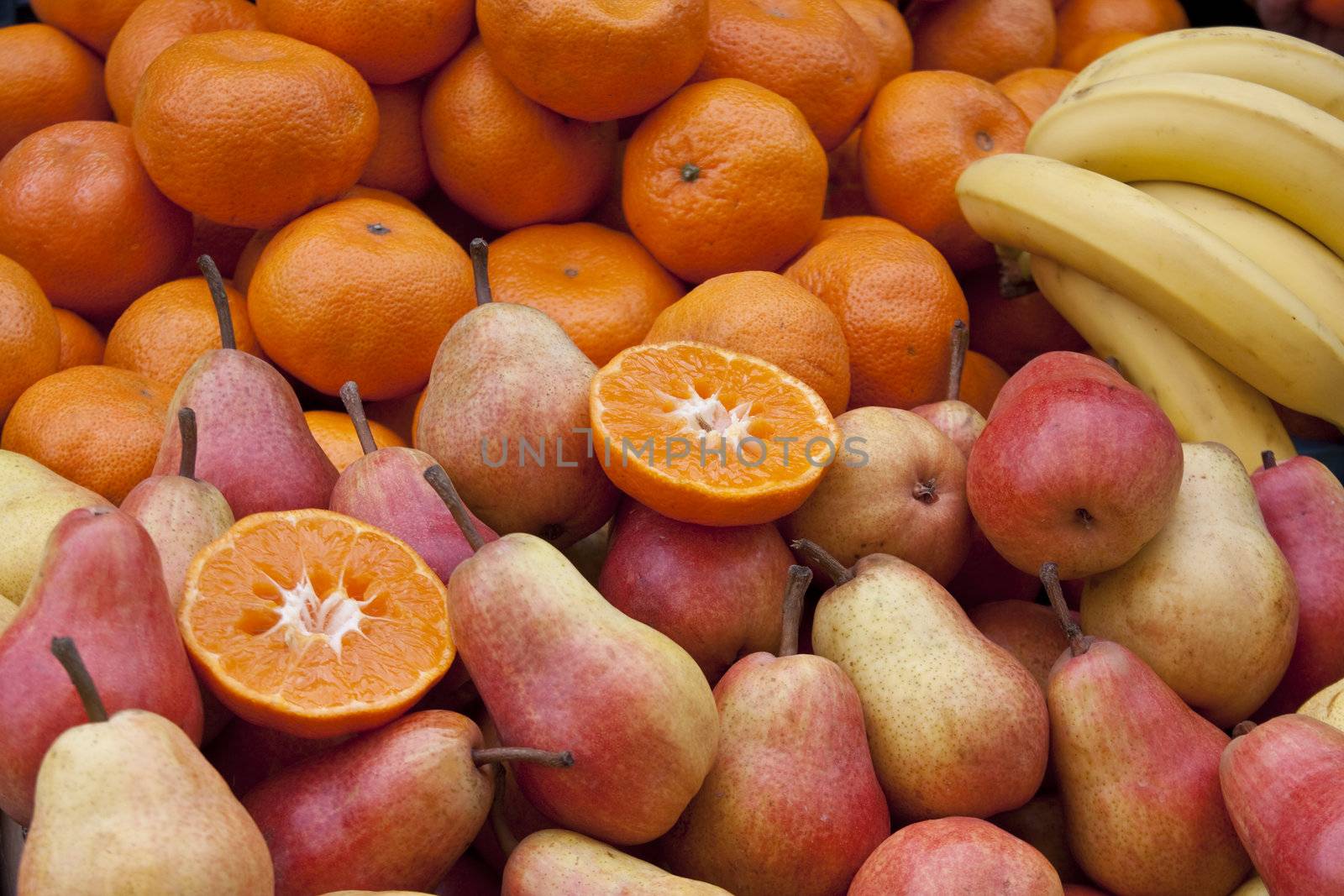 pears, tangerines and bananas in the fruit market