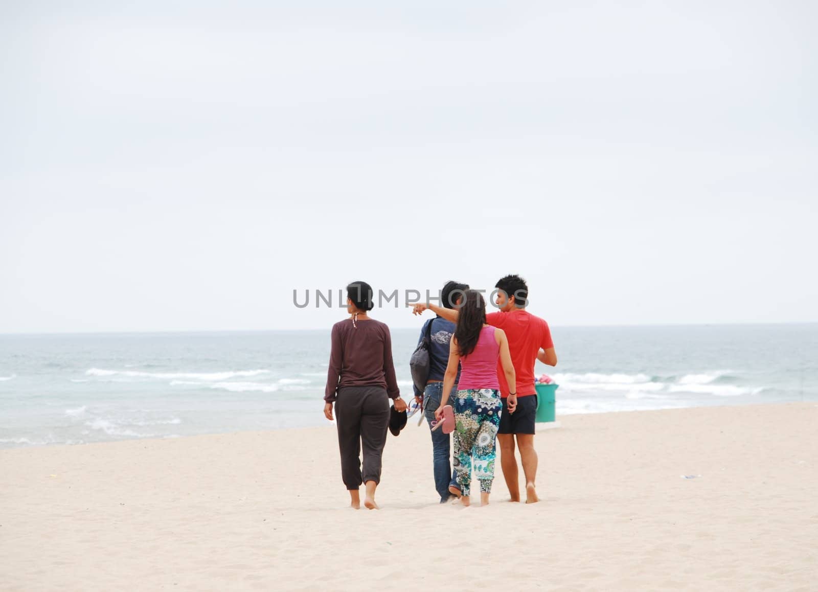 Beautiful family walking on beach by luissantos84