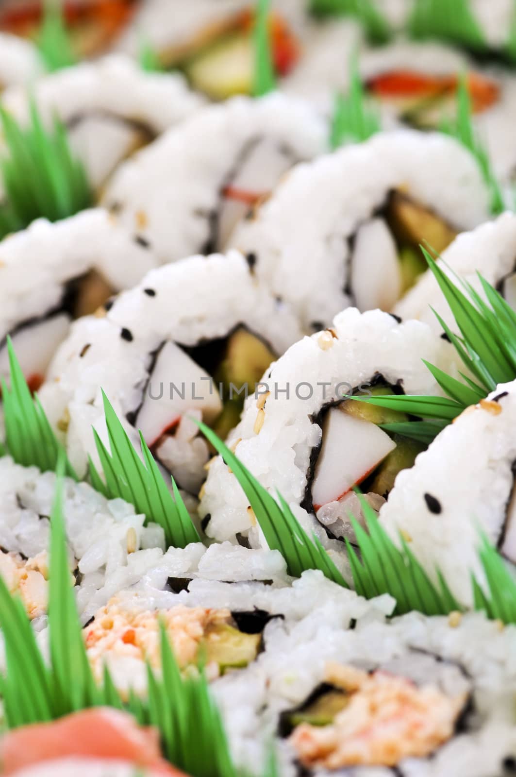 Close up on tray of assorted sushi appetizers