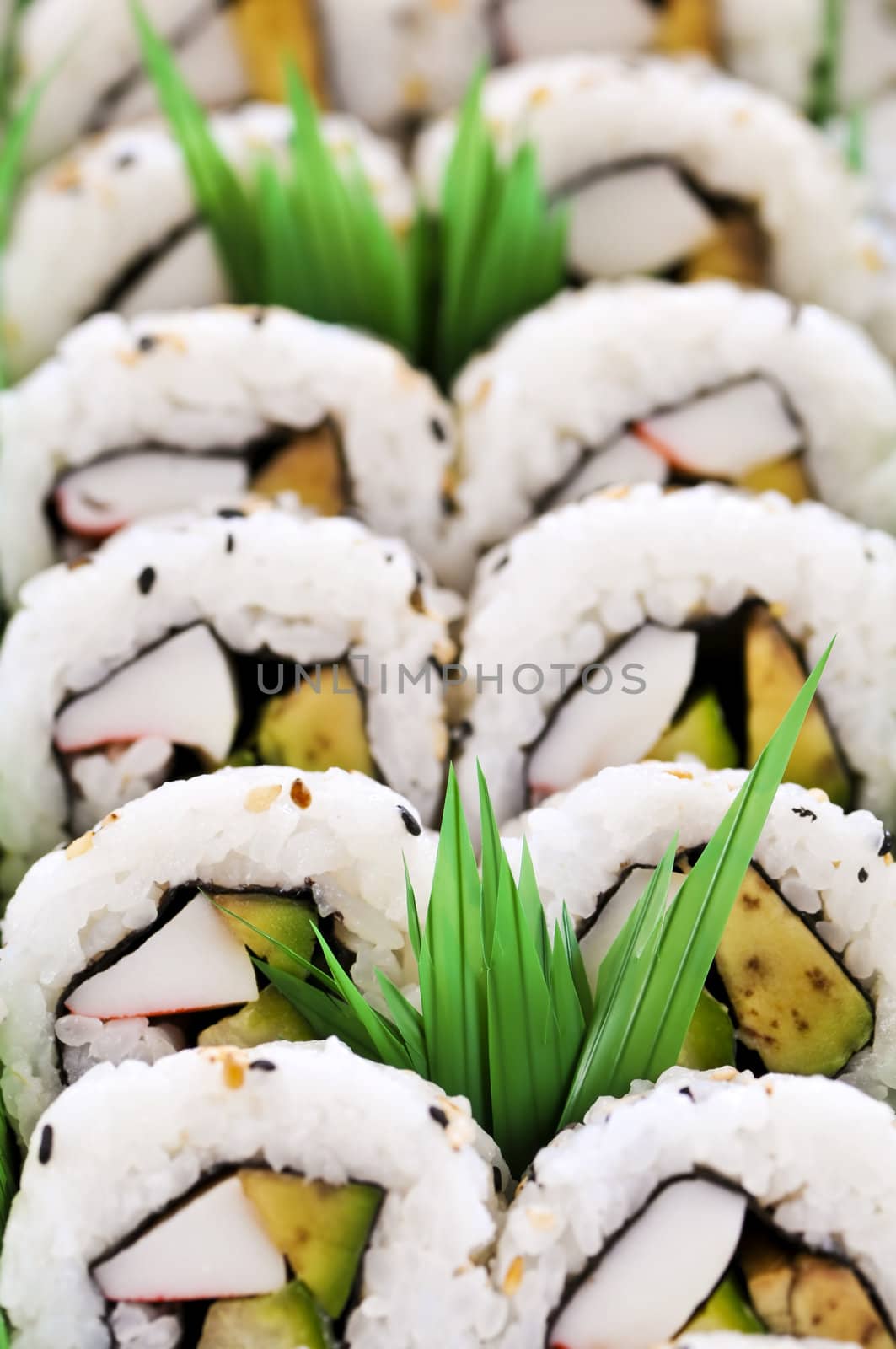 Close up on tray of assorted sushi appetizers