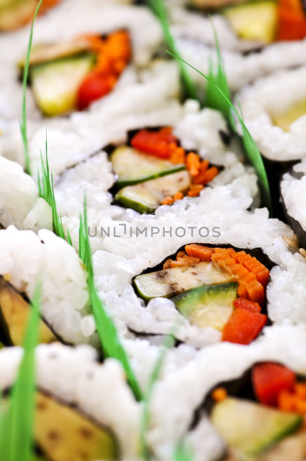 Close up on tray of assorted sushi appetizers