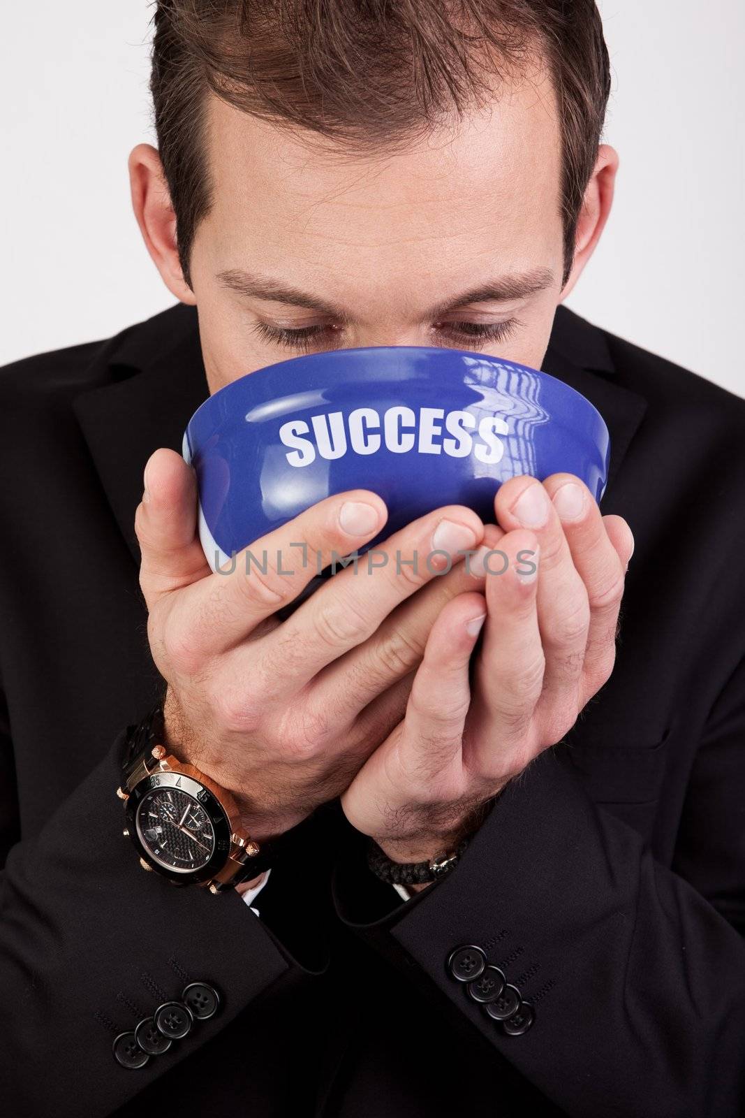 Conceptual portrait of successful businessman enjoying success