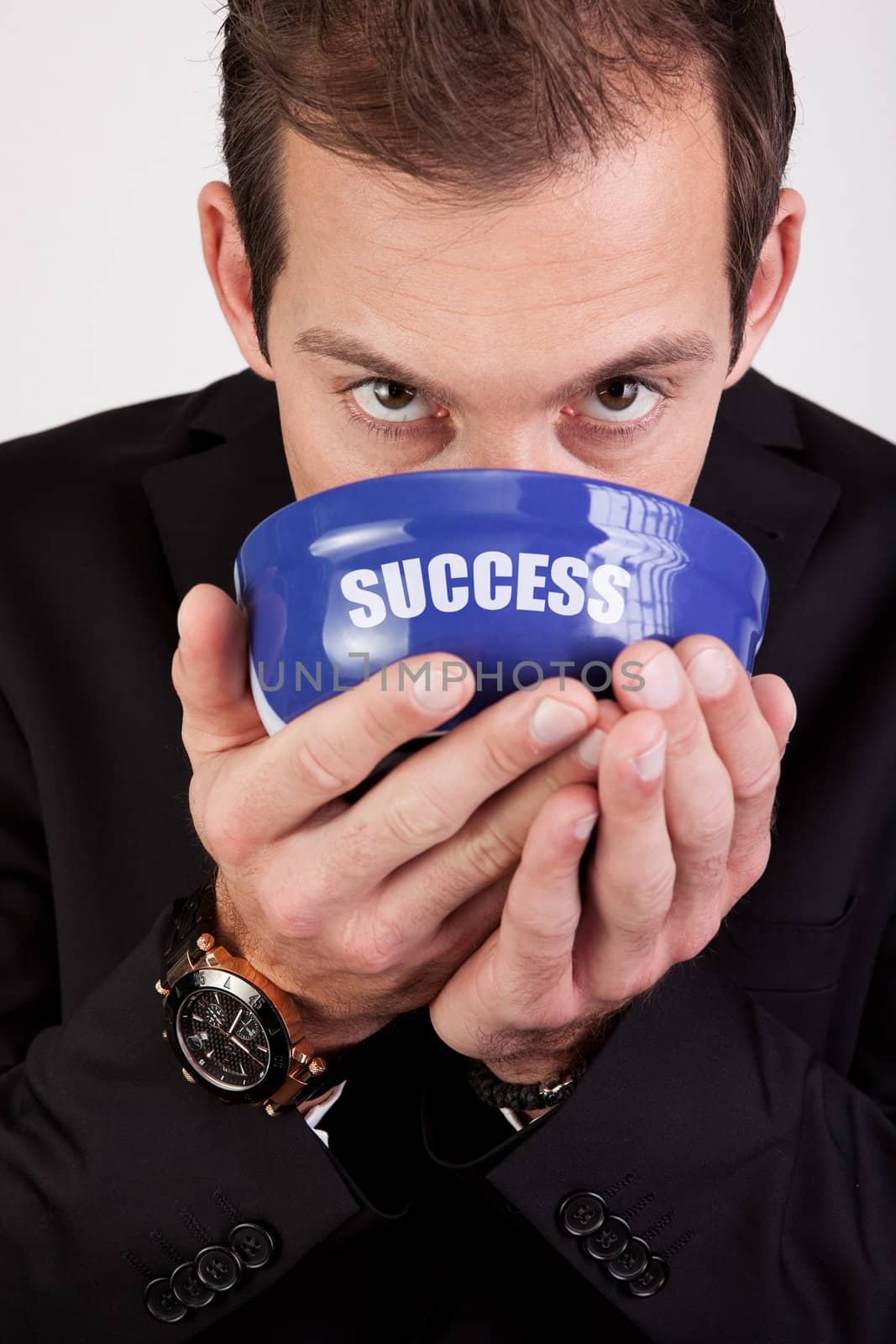 Conceptual portrait of successful businessman enjoying success