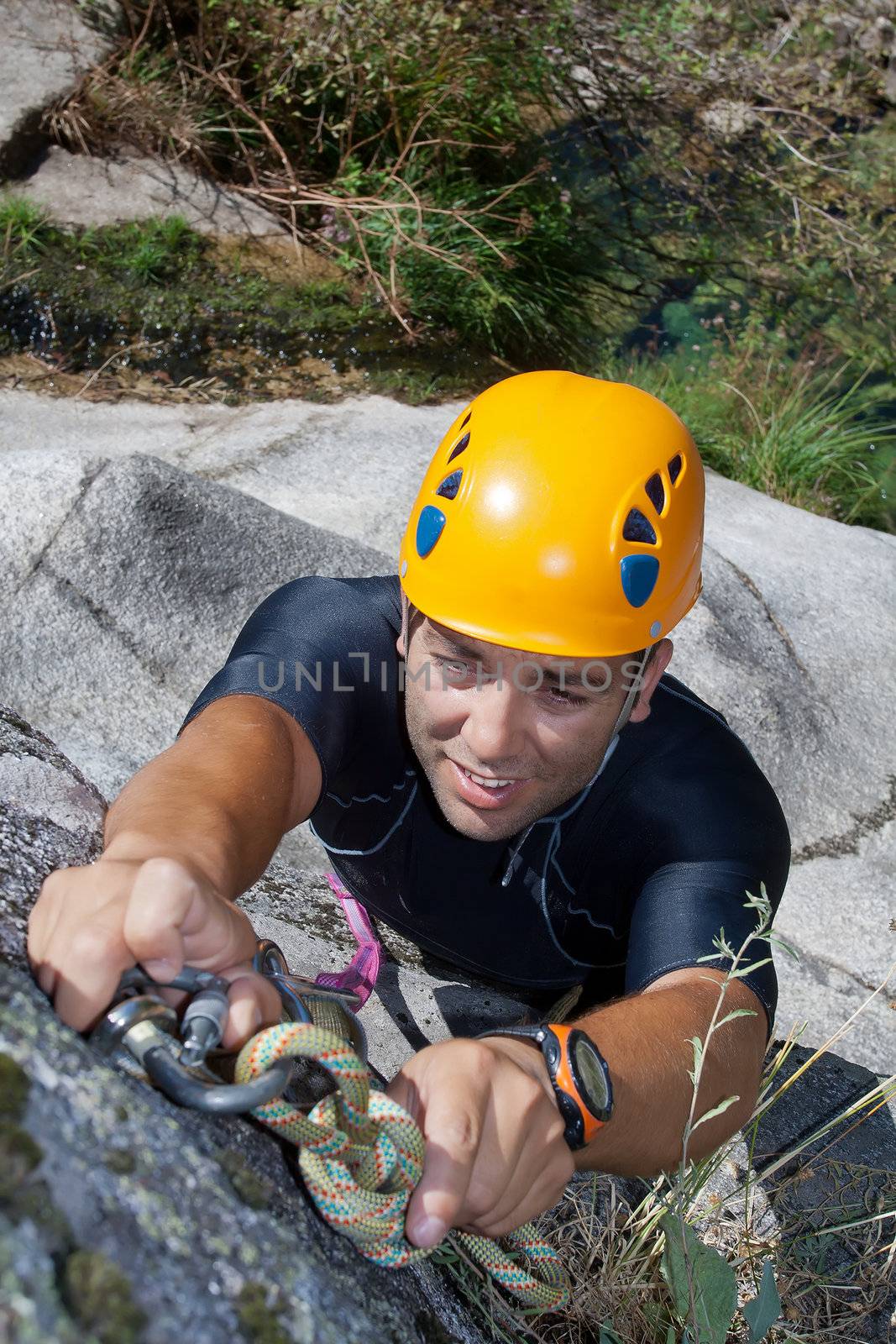 Men prepering to rappeling on waterfall