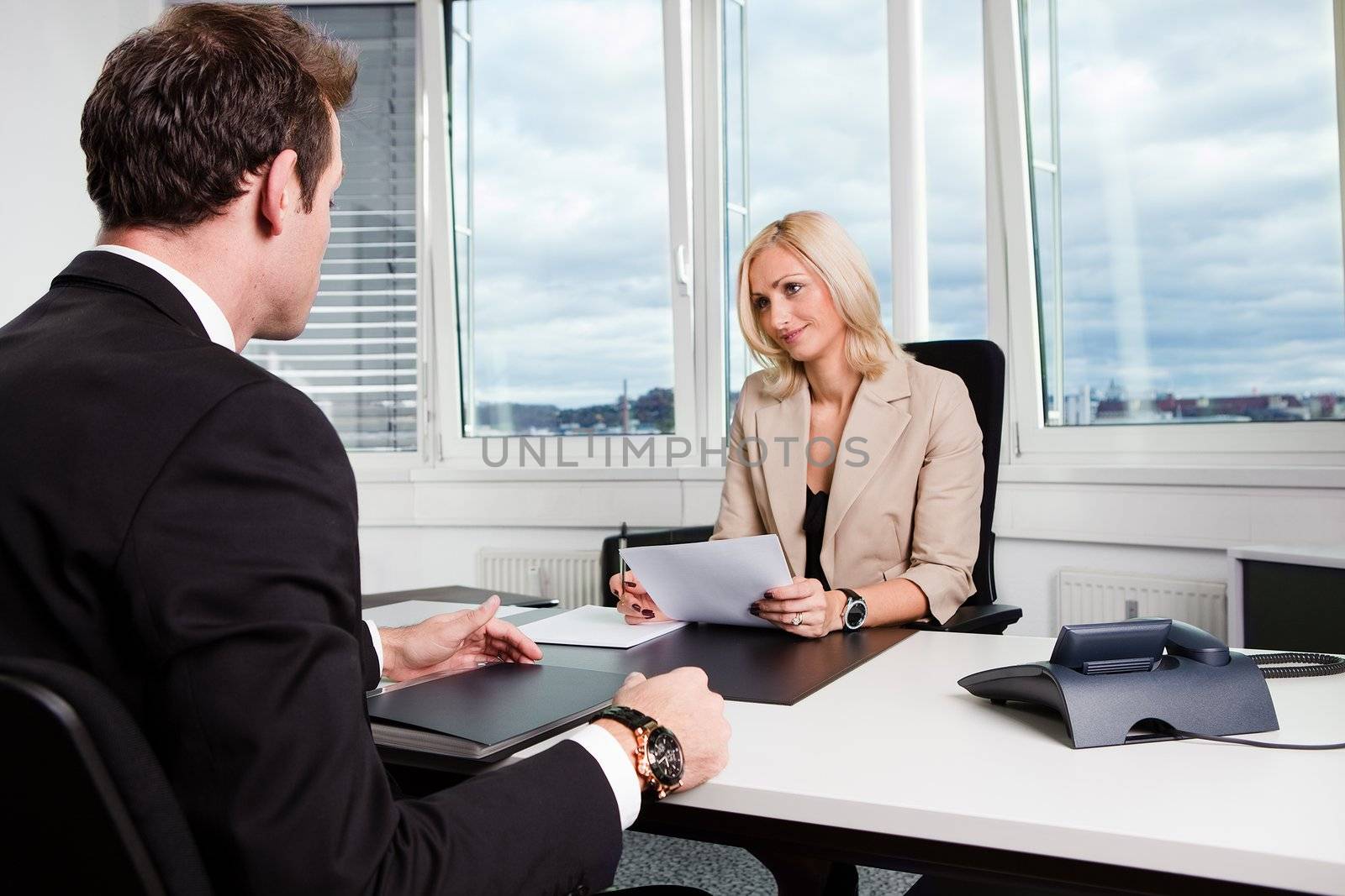 Two businesspeople at an interview in the office