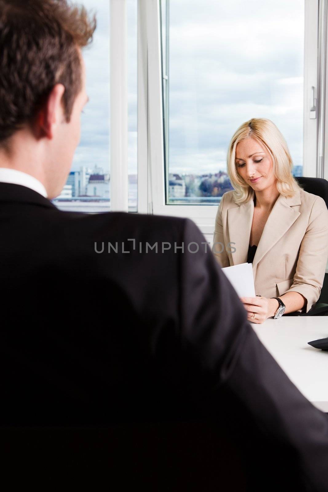 Two businesspeople at an interview in the office
