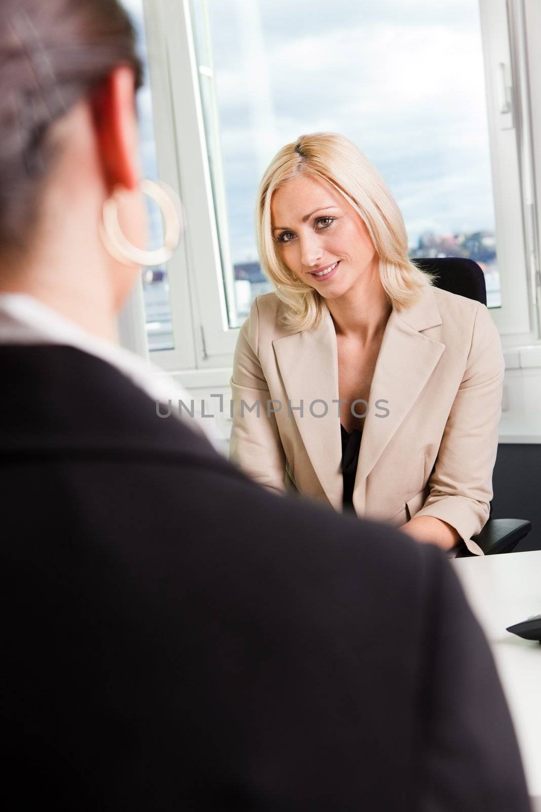 Two businesspeople at an interview in the office