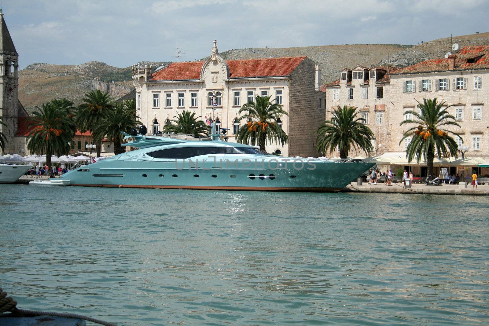 blue yacht moored in Trogir