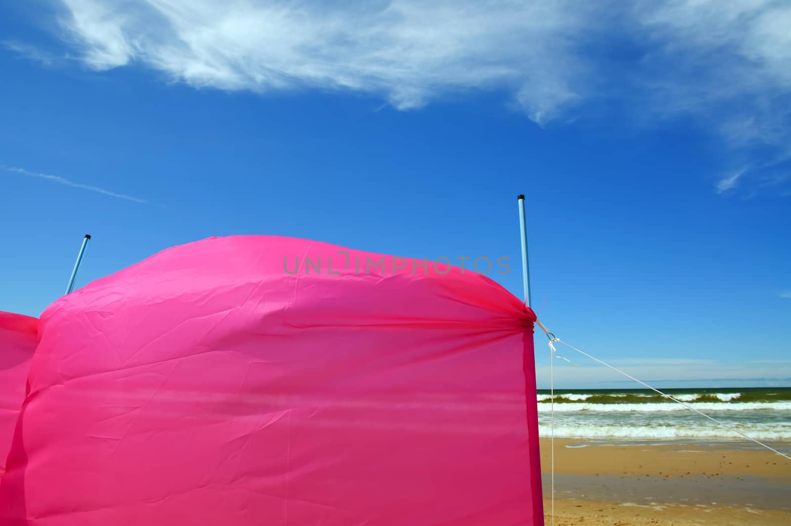 A pink windscreen on the beach 