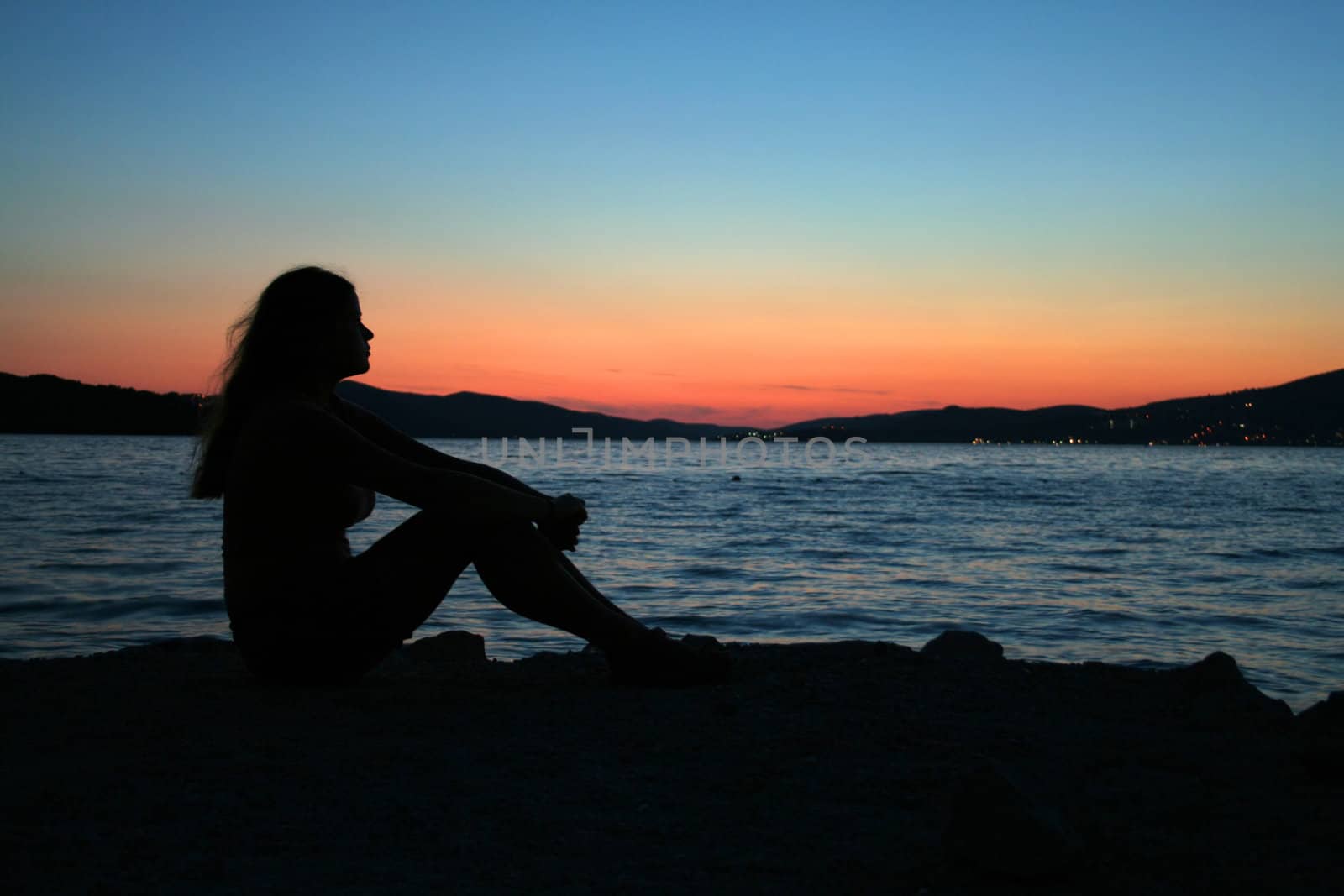 beautifull woman sitting on the beach by furzyk73