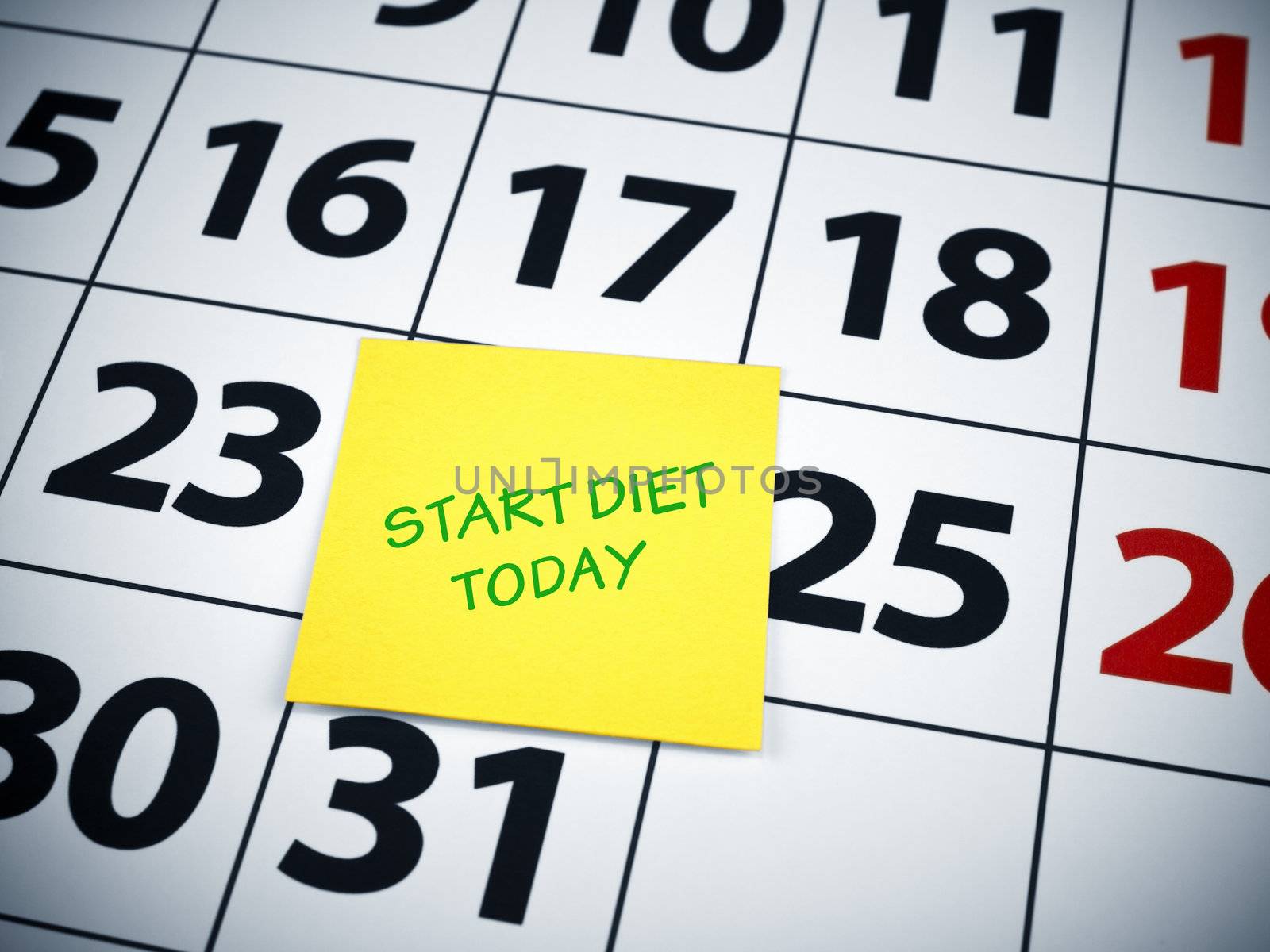 Start diet today written on a sticky note on a calendar.