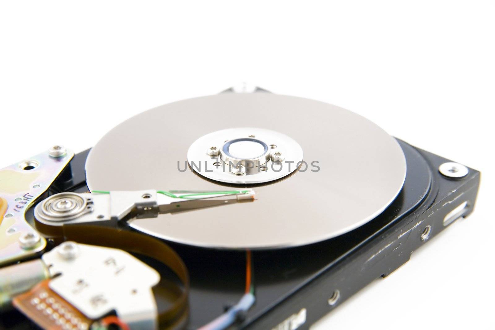 Close-up of the opened hard disc drive on the white background