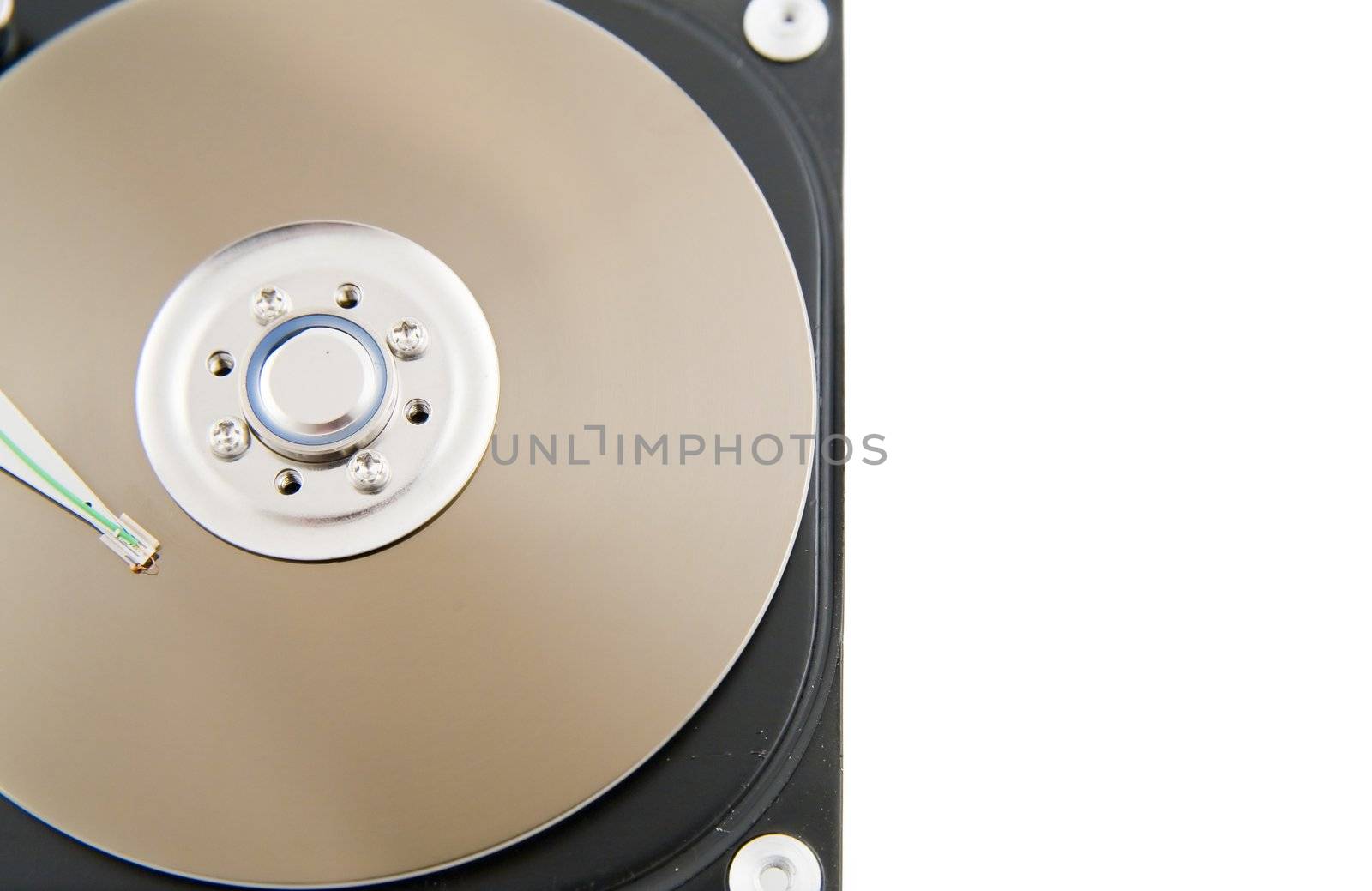 Close-up of the opened hard disc drive on the white background