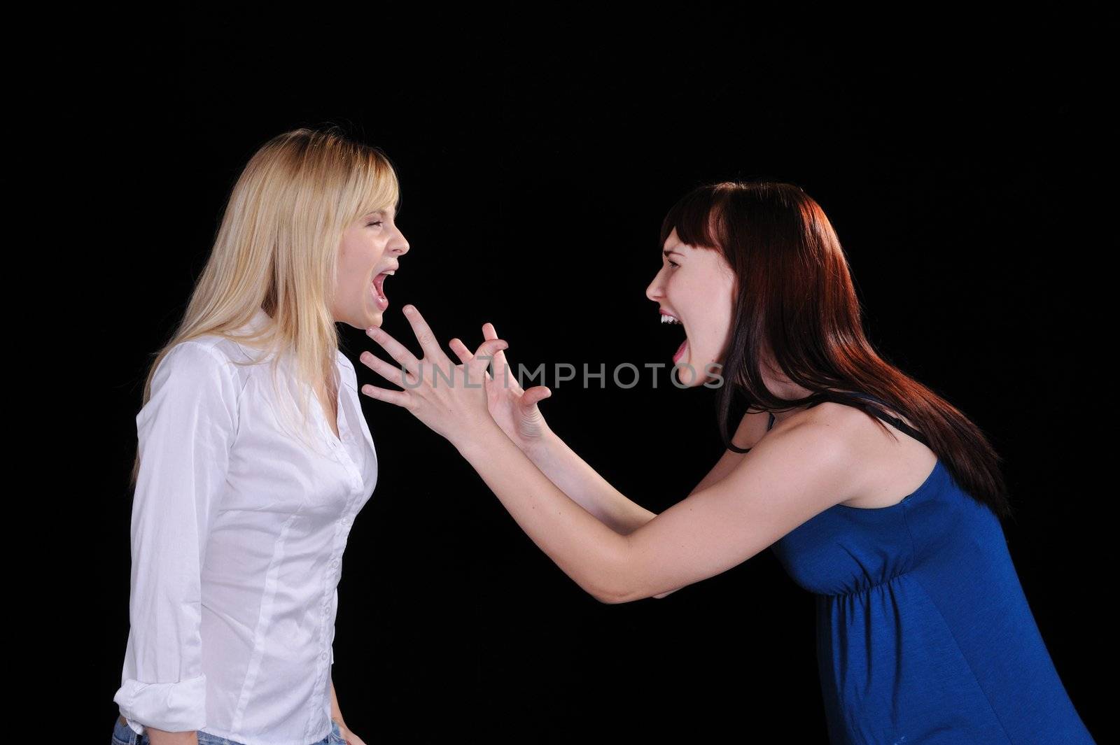 a screaming mad woman reaching out to grab another woman