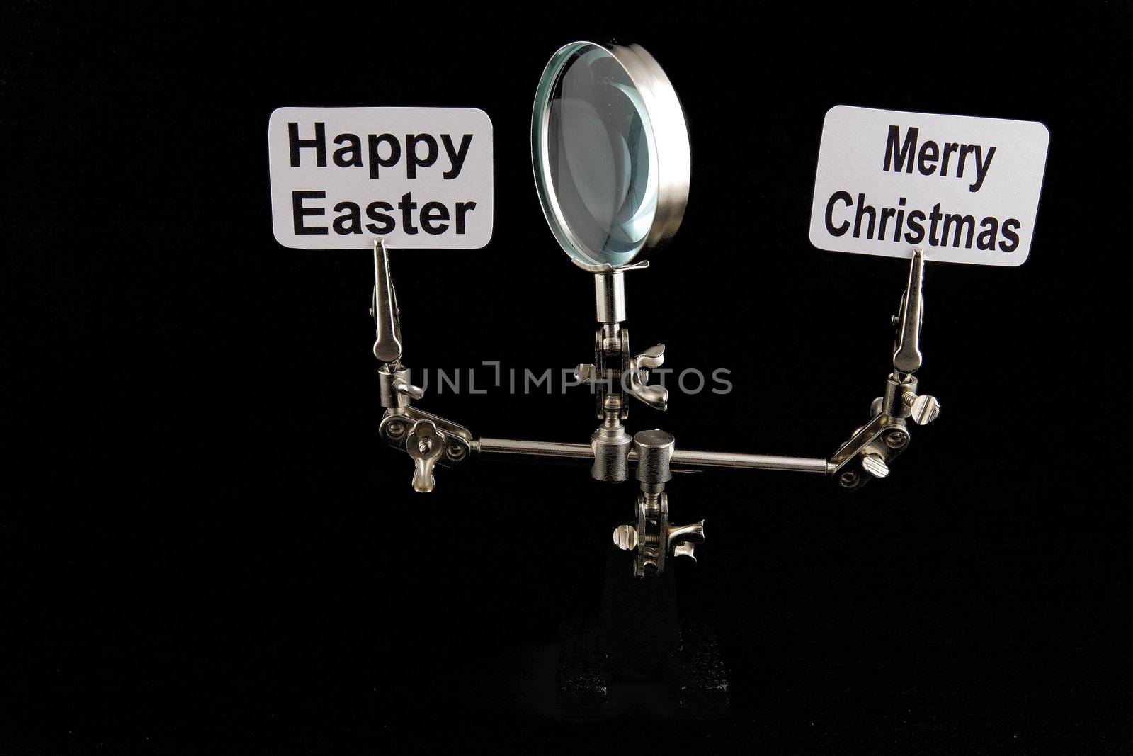 figure of steel man with "Happy Easter" and "Merry Chrostmas" inscriptions on black background
