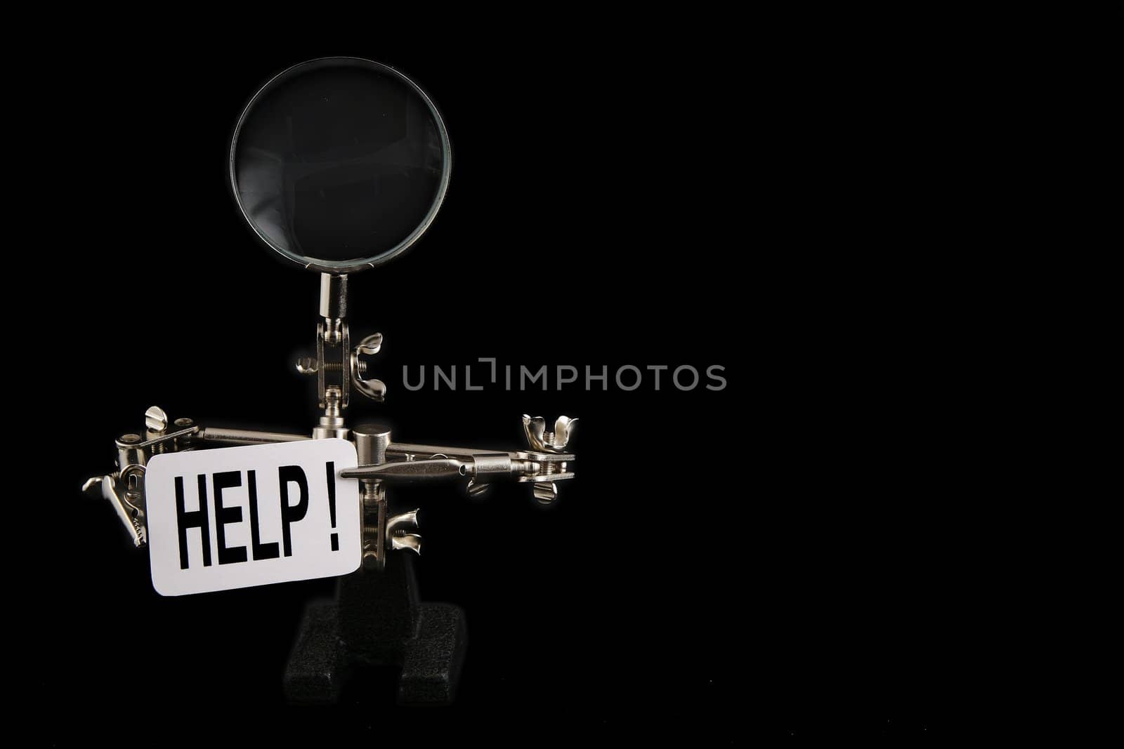 figure of steel man with "help" inscription on black background