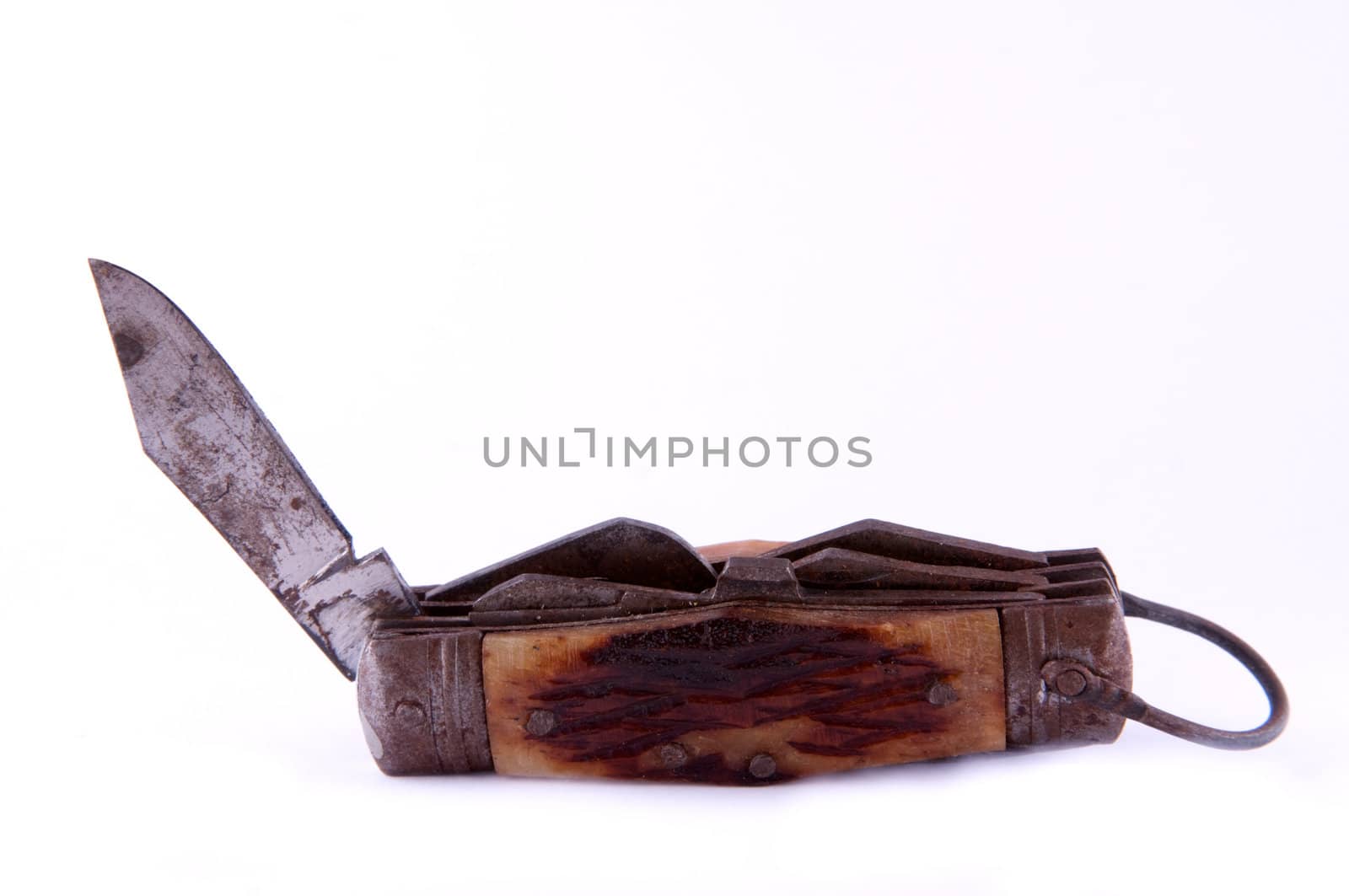 An antique pocket knife with open blade, isolated on white