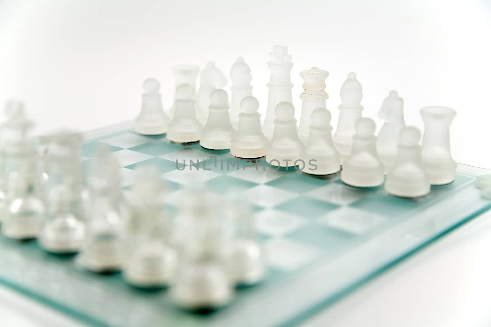 glass chess on the transparent chessboard